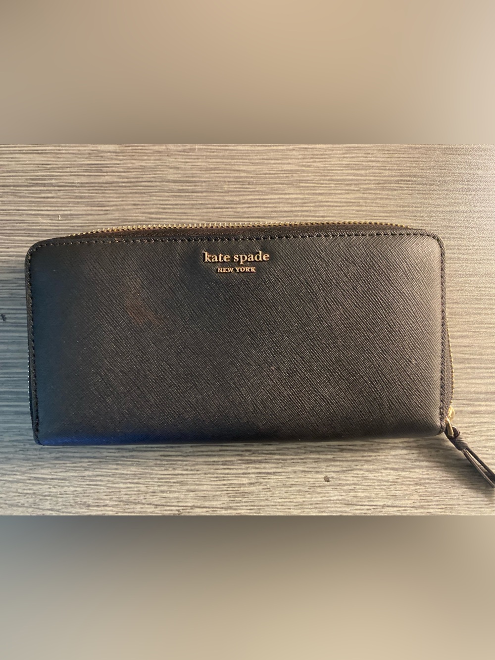 kate spade black saffiano zip-around wallet with gold logo